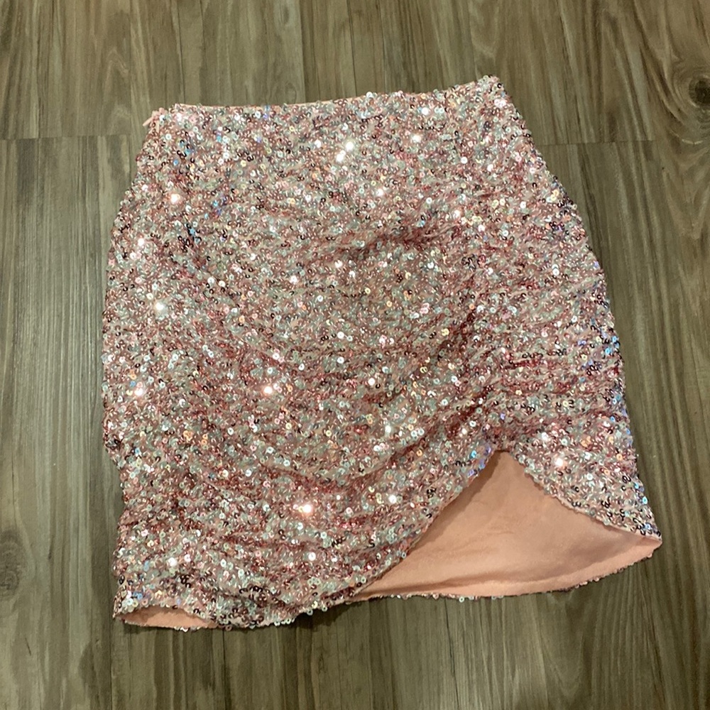 Amor studio sequined skirt with asymmetrical hem.